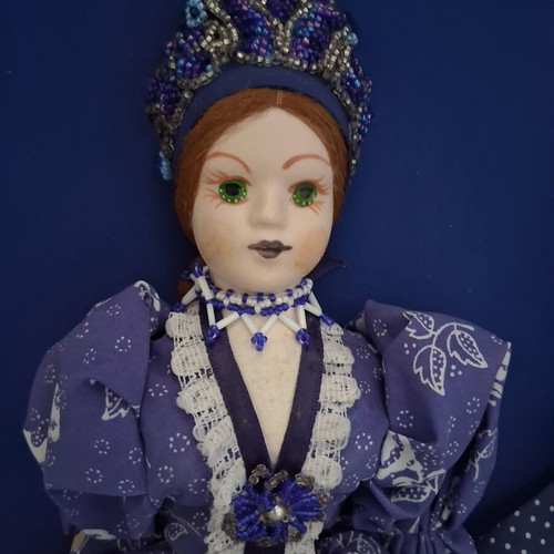 Vintage Slavic doll with porcelain head and fabric body