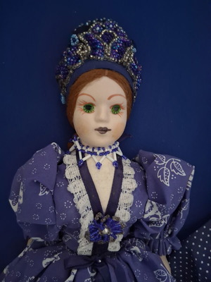 Vintage Slavic doll with porcelain head and fabric body