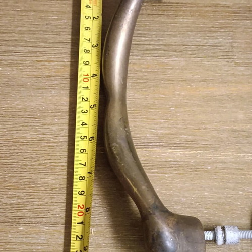 Pair of vintage brass door handles 1950 with natural patina used
