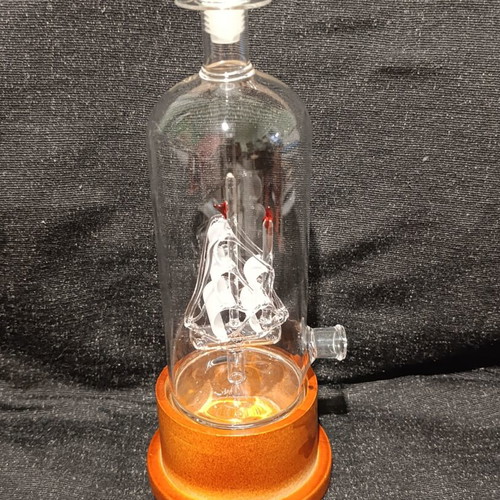 Vintage glass decanter with ship inside, used
