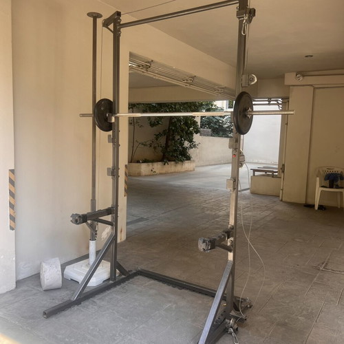 Training rack with barbell and pulley system