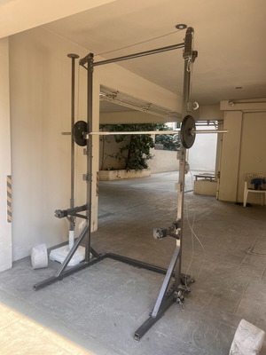 Training rack with barbell and pulley system