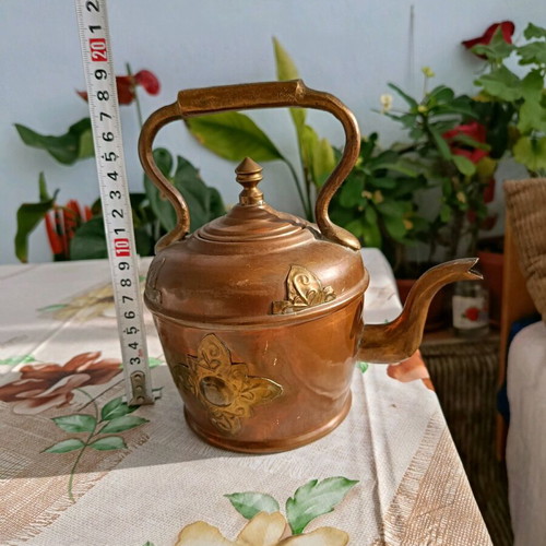 French teapot used with vintage brass decoration