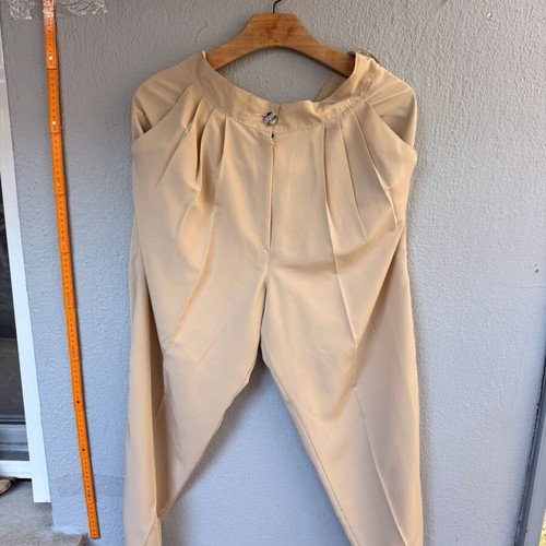 Women's high-waisted pants with pleats used, beige