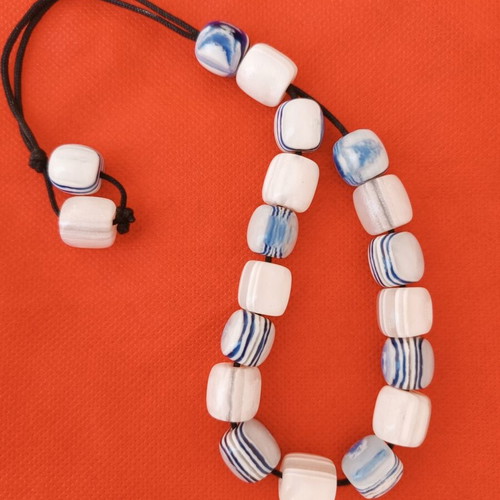 Worry beads with white and blue shiny beads