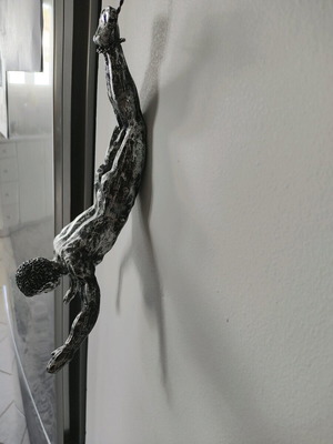 Wall decor like new, climbing man figure