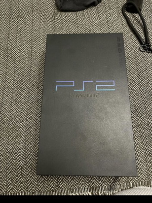 PlayStation 2 used with cables and functional