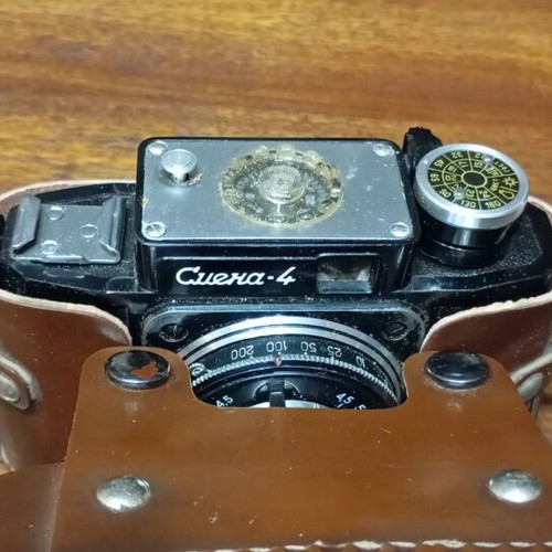 Retro Smena-4 camera used with leather case and tripod mount