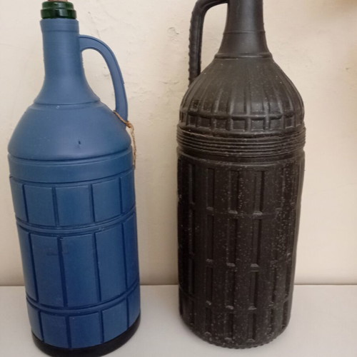 Glass bottles set of 2 used, one with moisture marks