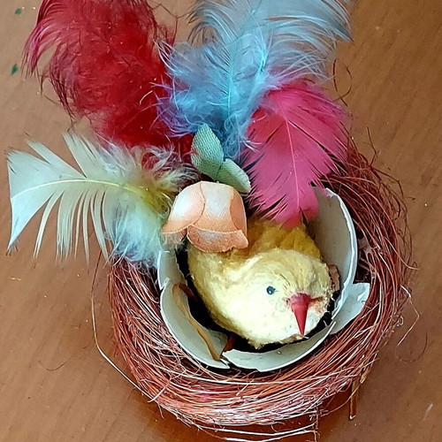 Vintage Easter nest used with yellow chick and colorful feathers