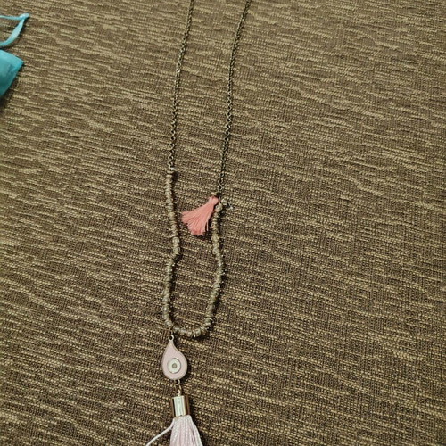 Long necklace used with pink evil eye and tassel