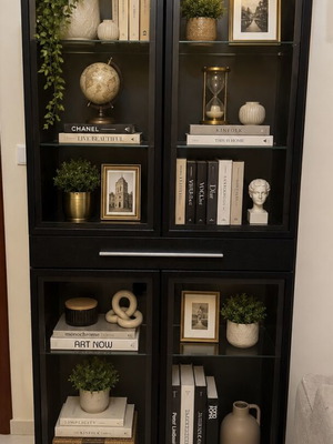 Black showcase with glass doors used, sturdy and well-maintained