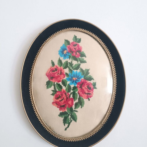 Vintage handmade cross-stitch frame with velvet oval border used