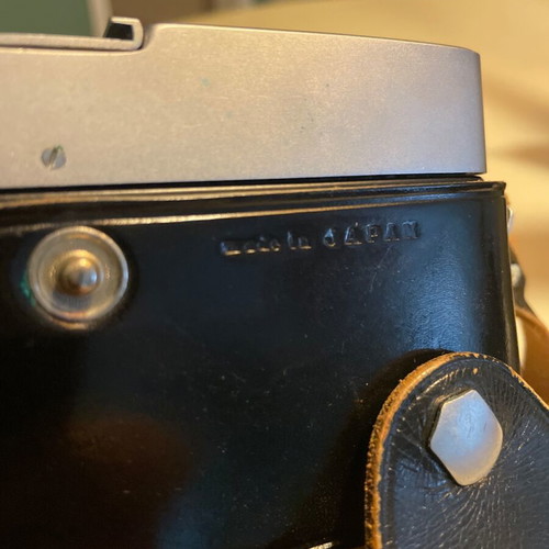 Canon Canonet vintage camera with 45mm f/1.9 lens and leather case like new
