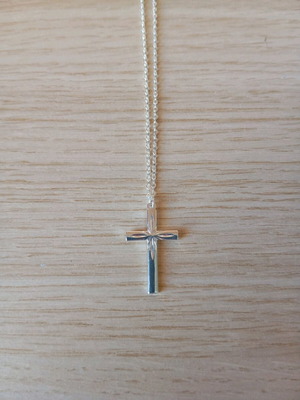 Steel cross like new, silver color