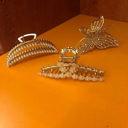 Metal hair clips like new, 3 gold with designs