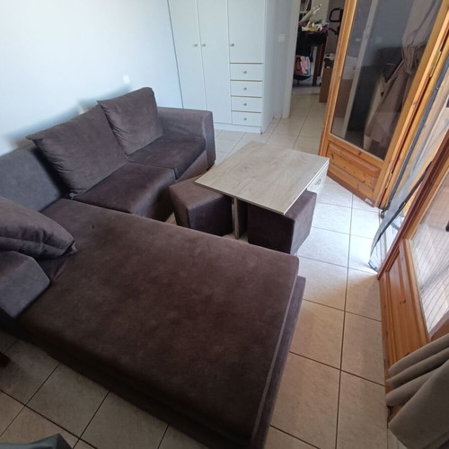 Corner sofa with waterproof fabric, cushions and coffee table with stools and storage cabinets