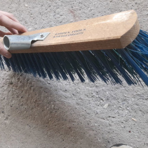Street brush new with stiff bristles and metal handle
