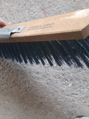 Street brush new with stiff bristles and metal handle
