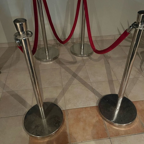 Stainless steel floor posts like new, set of 4 with red velvet rope