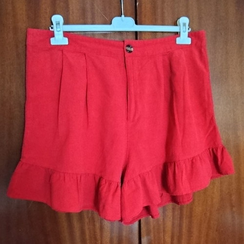 High-waisted women's red shorts like new with ruffles and pleats