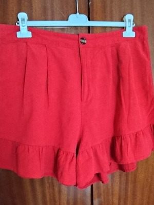 High-waisted women's red shorts like new with ruffles and pleats