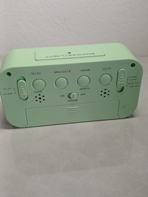 Digital tabletop clock used with alarm