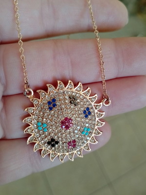 Sun-shaped women's necklace with zircon, like new, gold tone