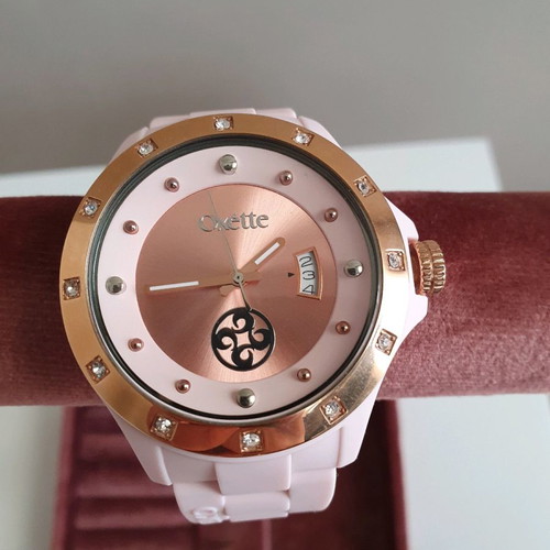 Oxette pink women's watch with rubber strap and pink gold dial like new