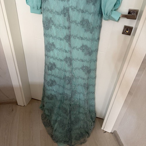 Long turquoise dress with lace embroidery and satin details