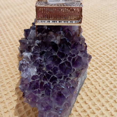 Vintage decorative piano on natural amethyst rock, gold-plated