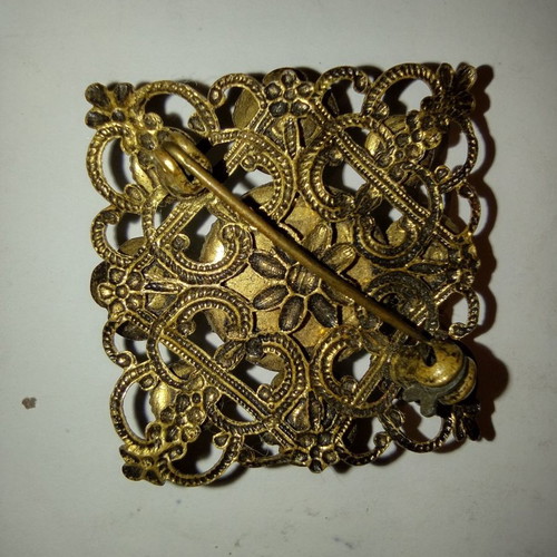 Antique filigree pin used, made of brass