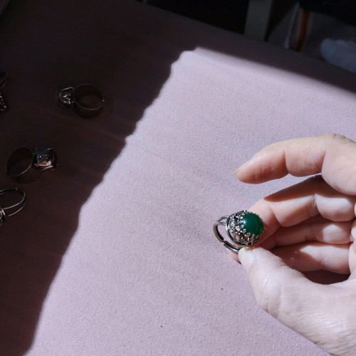 Vintage costume ring with green stone new, silver color