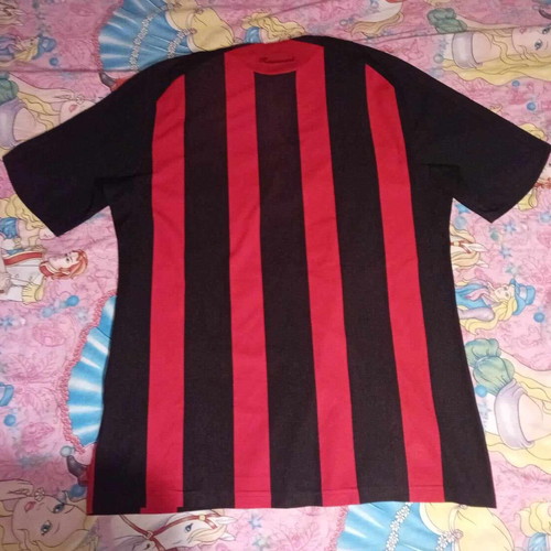 Milan football jersey used, medium size, with faded sponsor