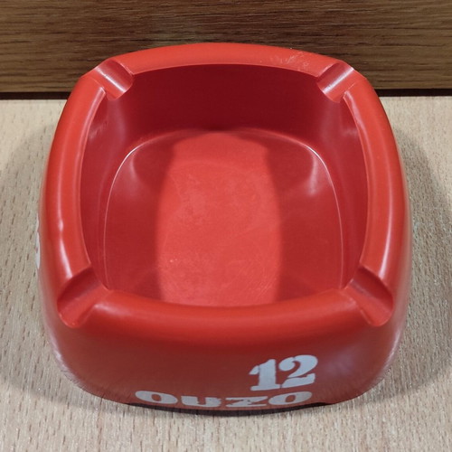 Ouzo 12 used red square plastic ashtray