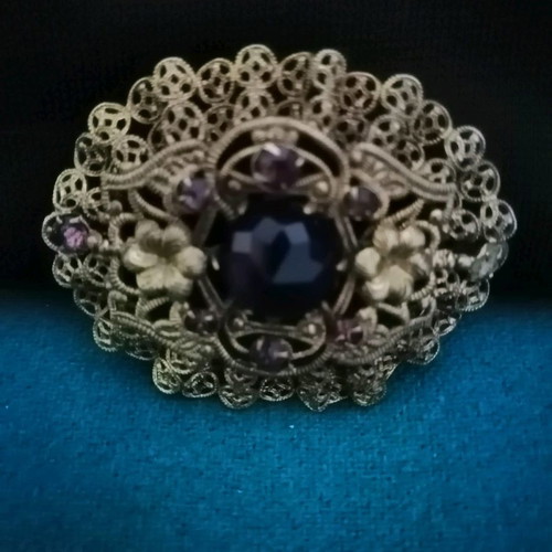 Vintage filigree brooch like new with central stone and rose crystals