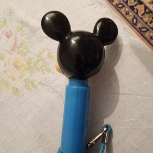 Disney umbrella used with blue Mickey Mouse handle, multicolored