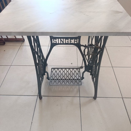 Vintage table console with Singer cast iron base and marble top used