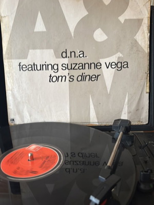 D.N.A. Featuring Suzanne Vega Tom's Diner vinyl used in good condition