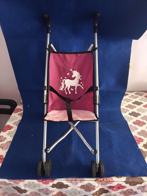 Toy stroller like new, lightweight and foldable
