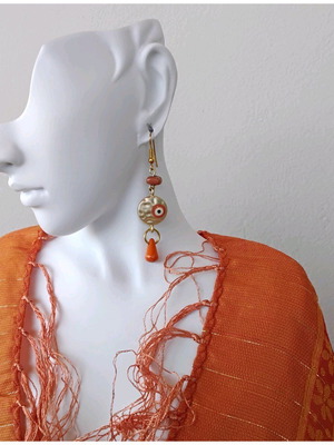Handmade earrings with orange details and Greek eye