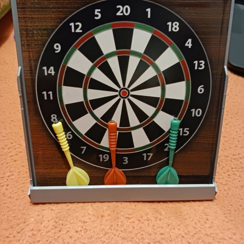 Tabletop dartboard unused with 3 darts