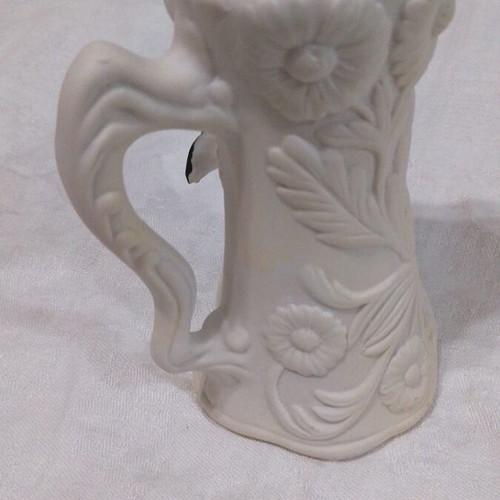 Small ceramic vase like new with embossed flower
