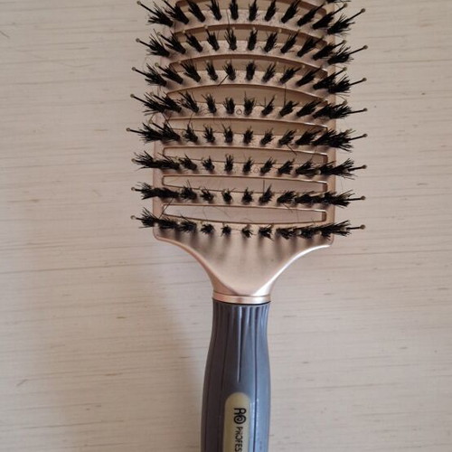 Hair comb with short bristles and openings