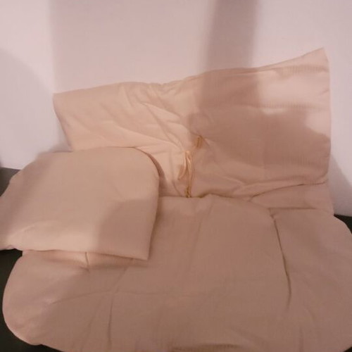 Baby bassinet used with wooden base and beige mattress