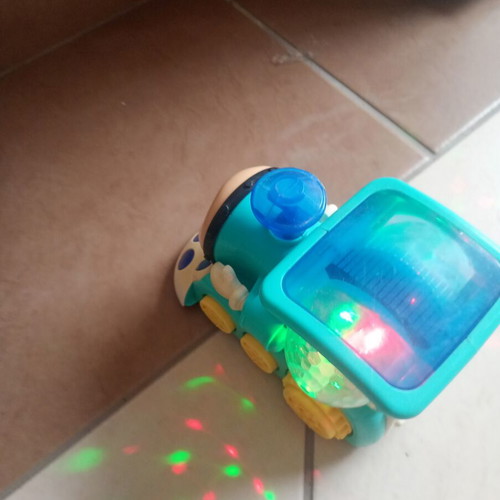 Cute Train toy with sounds, lights and movement, used
