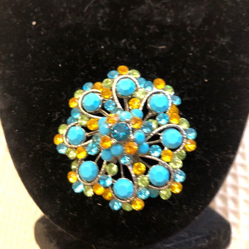 Flower brooch with turquoise stones like new
