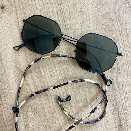Polygonal statement sunglasses with asymmetrical design and strap