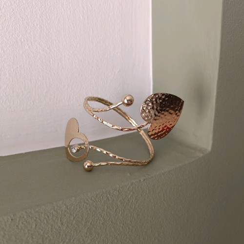 Cuff bracelet used with 2 gold-tone hearts