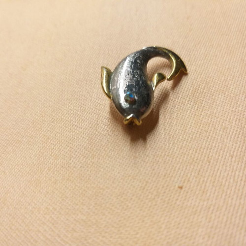 Dolphin pin used, silver and gold color